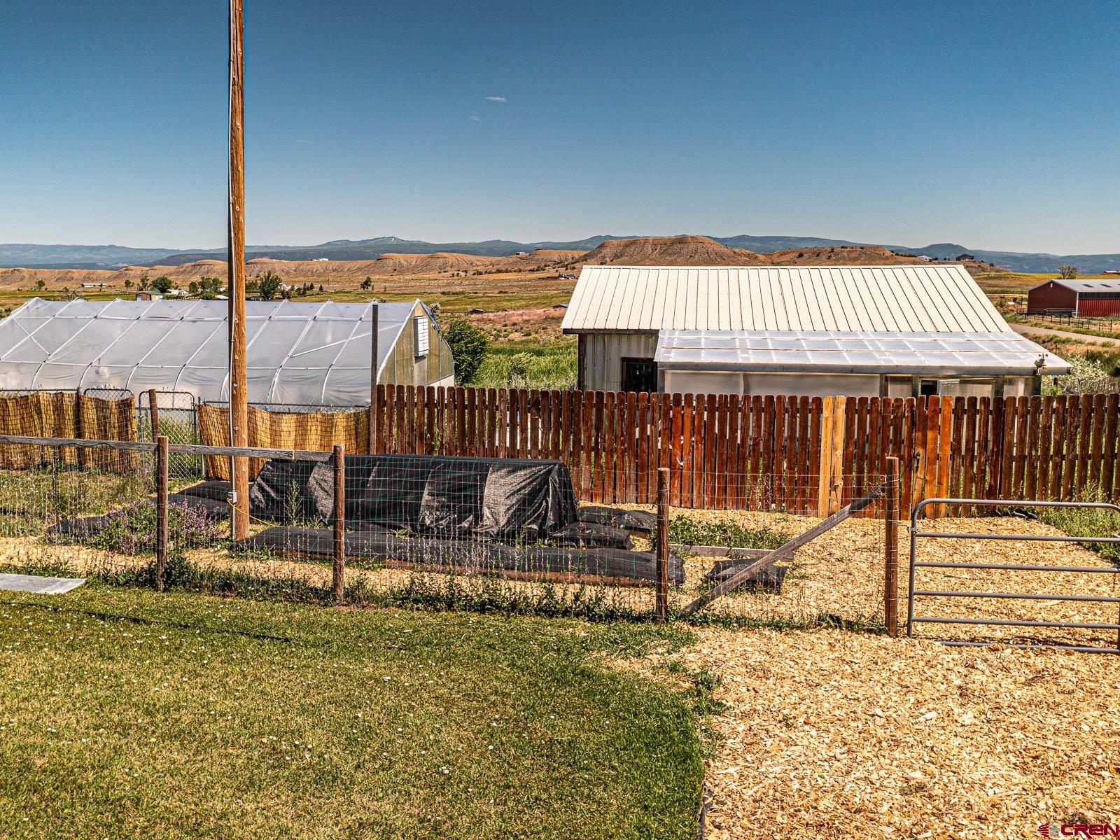 5085 3675th Road Crawford, CO 81415 - Photo 24 of 35 a view of a house with a backyard