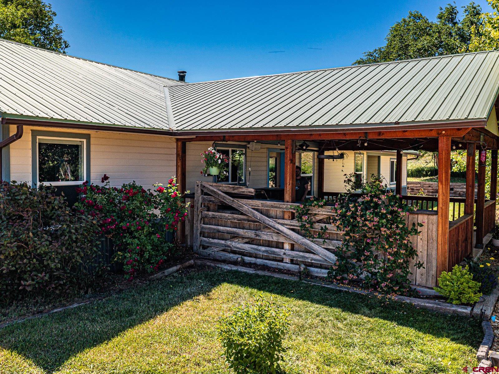 5085 3675th Road Crawford, CO 81415 - Photo 25 of 35 a front view of a house with a yard