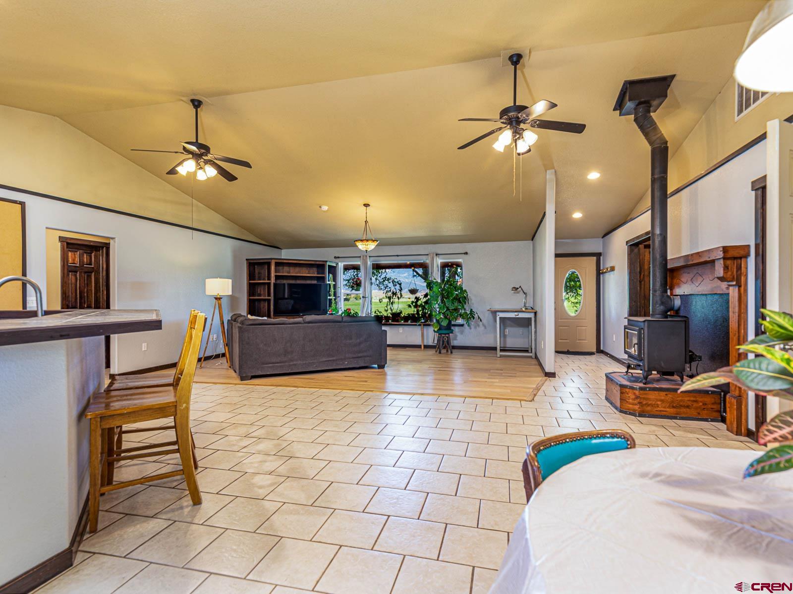 5085 3675th Road Crawford, CO 81415 - Photo 10 of 35 a bedroom with furniture and a chandelier