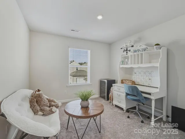 a workspace with furniture and window