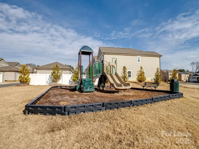 a room with pool table and glass door