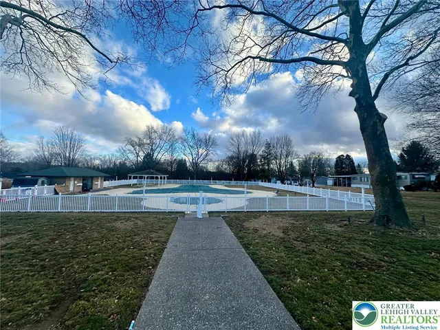 a view of a lake with a yard