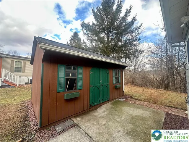 a house with trees in the background