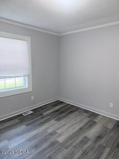 2445 Adams Avenue Macon, GA 31206 - Photo 16 of 30 an empty room with wooden floor and windows