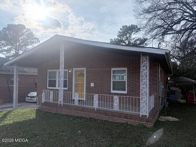 2445 Adams Avenue Macon, GA 31206 - Photo 2 of 30 a backyard of a house with table and chairs