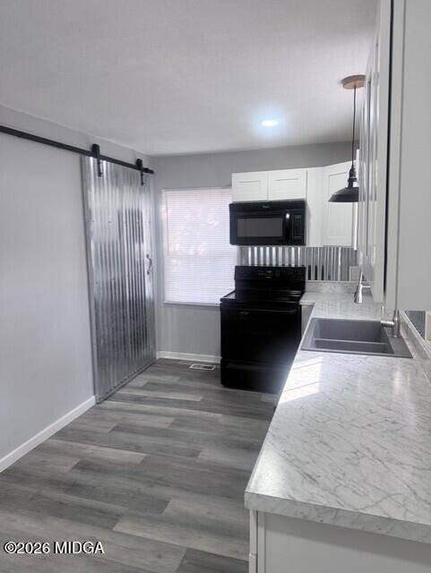 2445 Adams Avenue Macon, GA 31206 - Photo 21 of 30 a view of a hallway with wooden floor