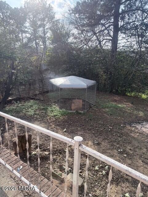 2445 Adams Avenue Macon, GA 31206 - Photo 30 of 30 a view of a wooden deck with a bench