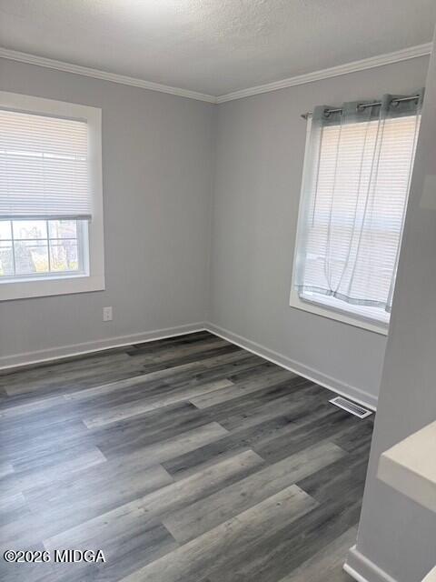 2445 Adams Avenue Macon, GA 31206 - Photo 7 of 30 a view of empty room with wooden floor and fan