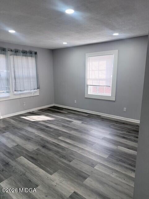 2445 Adams Avenue Macon, GA 31206 - Photo 8 of 30 an empty room with wooden floor and windows