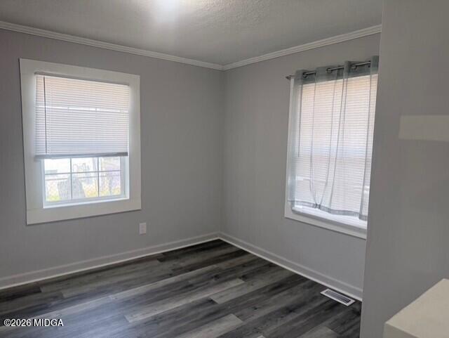 2445 Adams Avenue Macon, GA 31206 - Photo 9 of 30 an empty room with wooden floor and windows