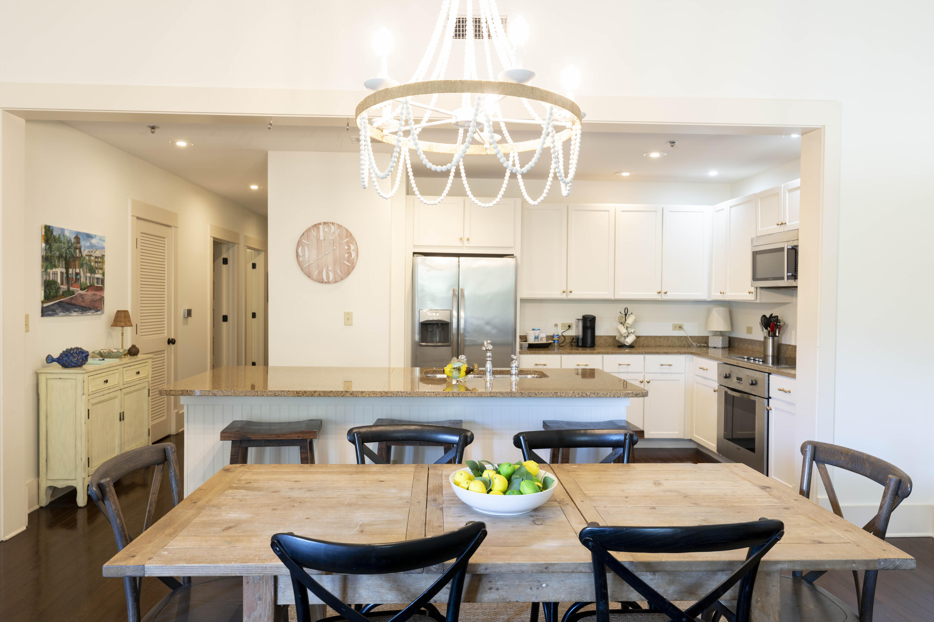 2046 West County Highway 30A, Unit M2230 Santa Rosa Beach, FL 32459 - Photo 11 of 39 a large kitchen with a table and chairs in it