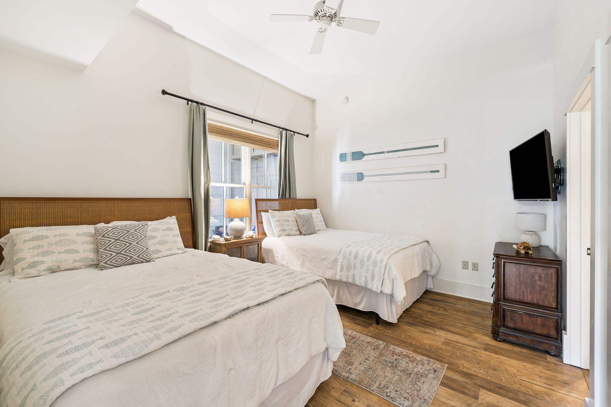 2046 West County Highway 30A, Unit M2230 Santa Rosa Beach, FL 32459 - Photo 18 of 39 a bedroom with two bed and a flat screen tv