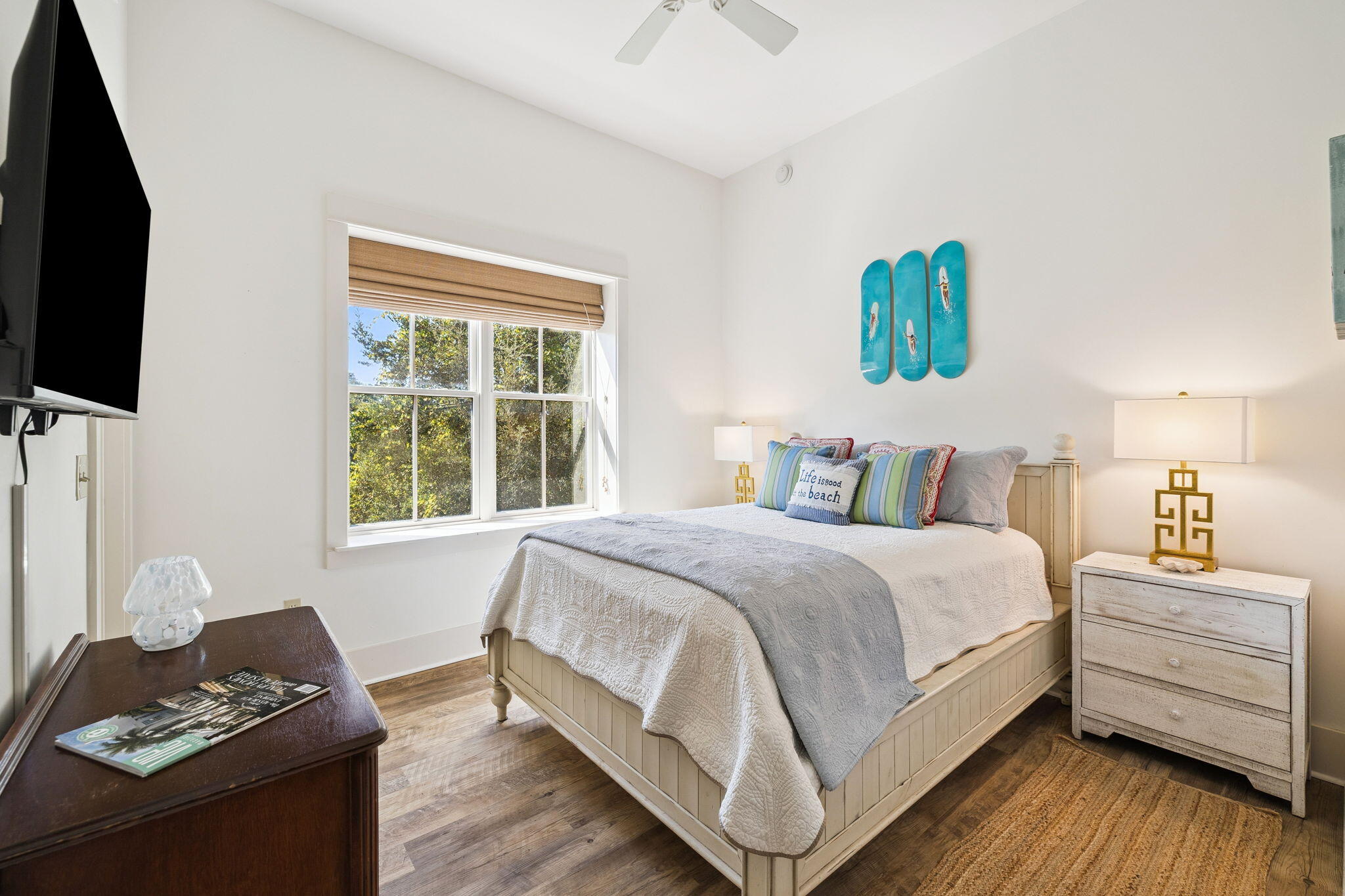 2046 West County Highway 30A, Unit M2230 Santa Rosa Beach, FL 32459 - Photo 22 of 39 a bedroom with a bed and a flat screen tv