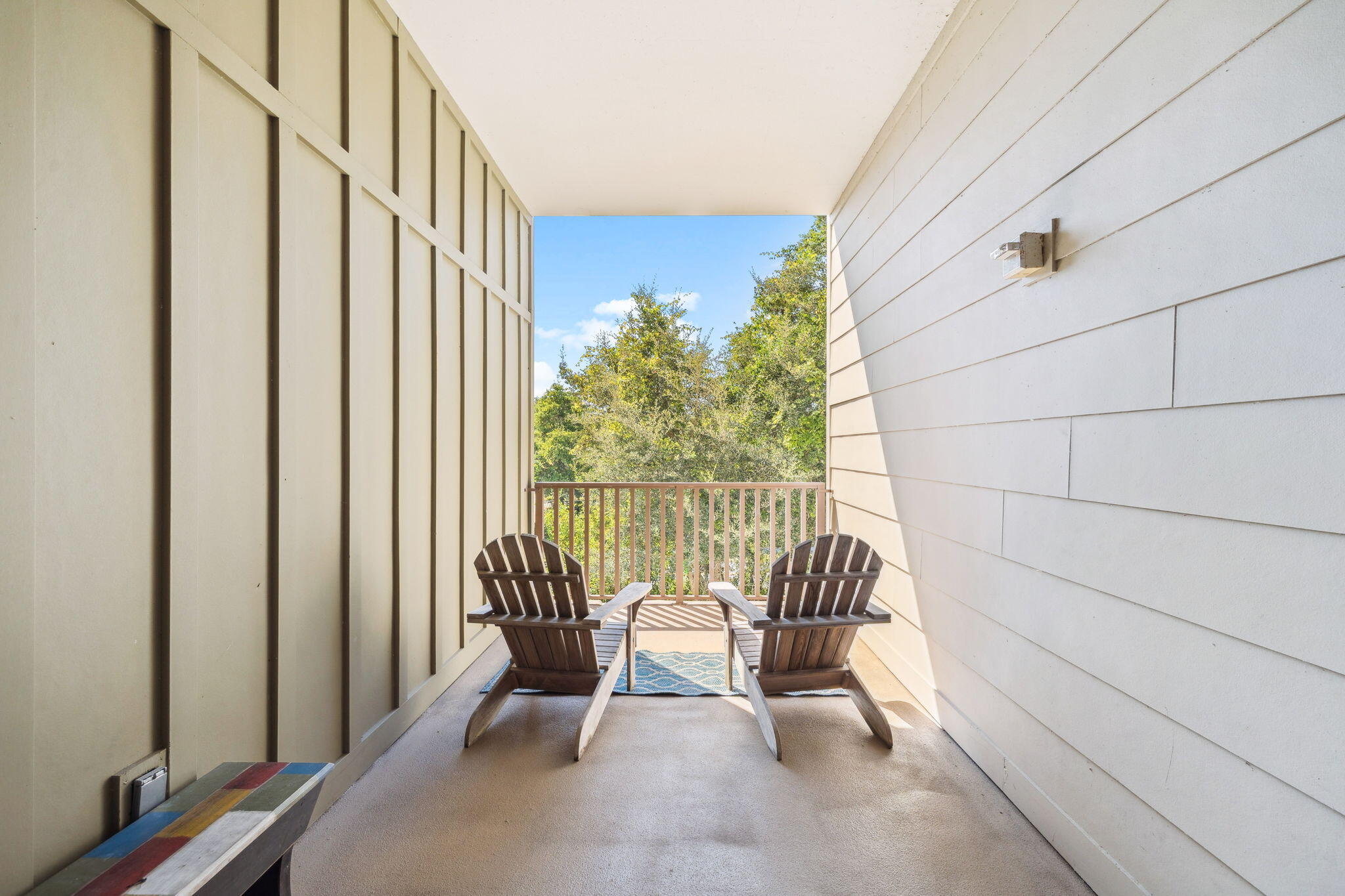 2046 West County Highway 30A, Unit M2230 Santa Rosa Beach, FL 32459 - Photo 30 of 39 a view of balcony with chair and potted plant