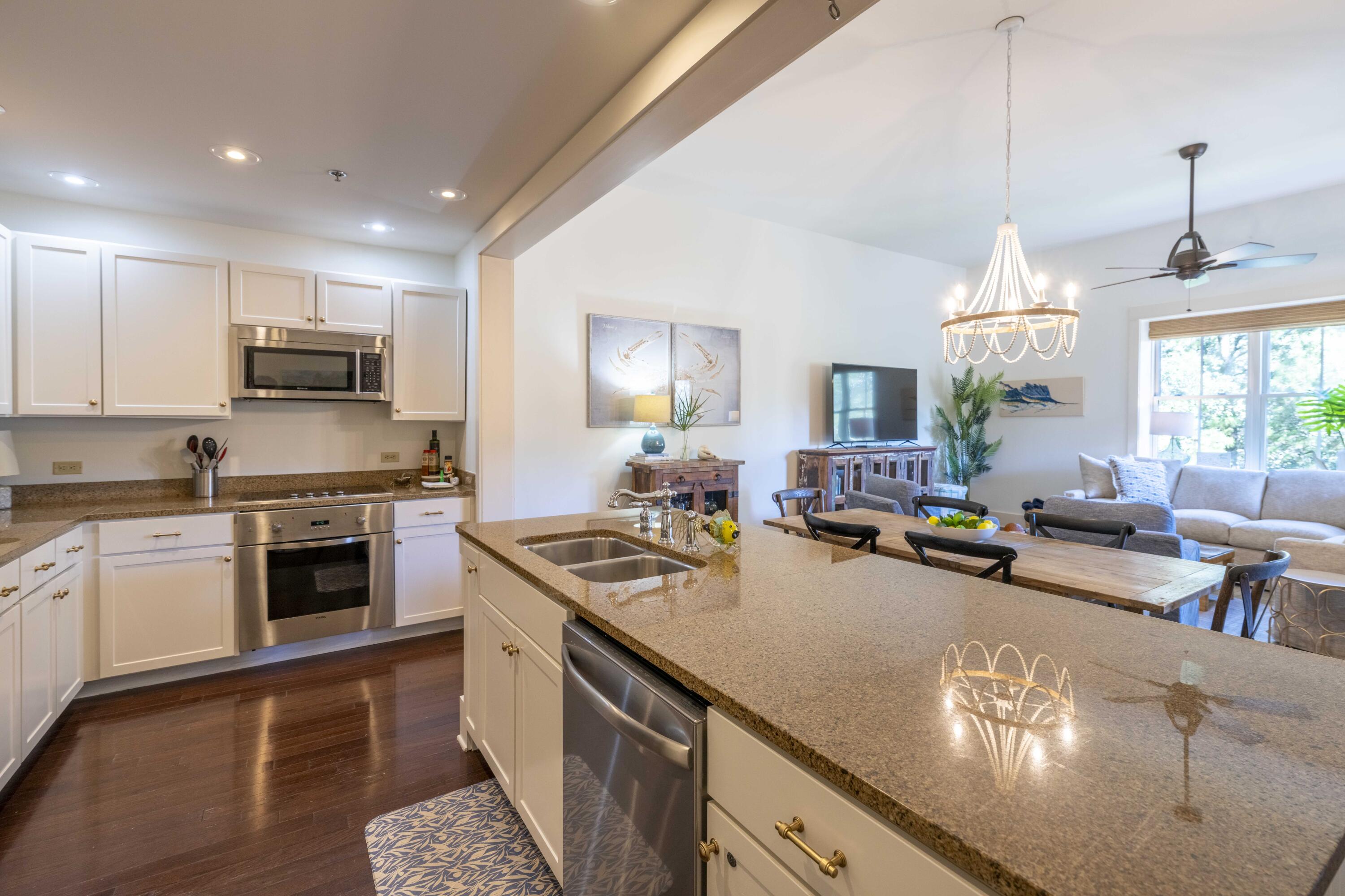 2046 West County Highway 30A, Unit M2230 Santa Rosa Beach, FL 32459 - Photo 3 of 39 a kitchen with a stove sink and cabinets