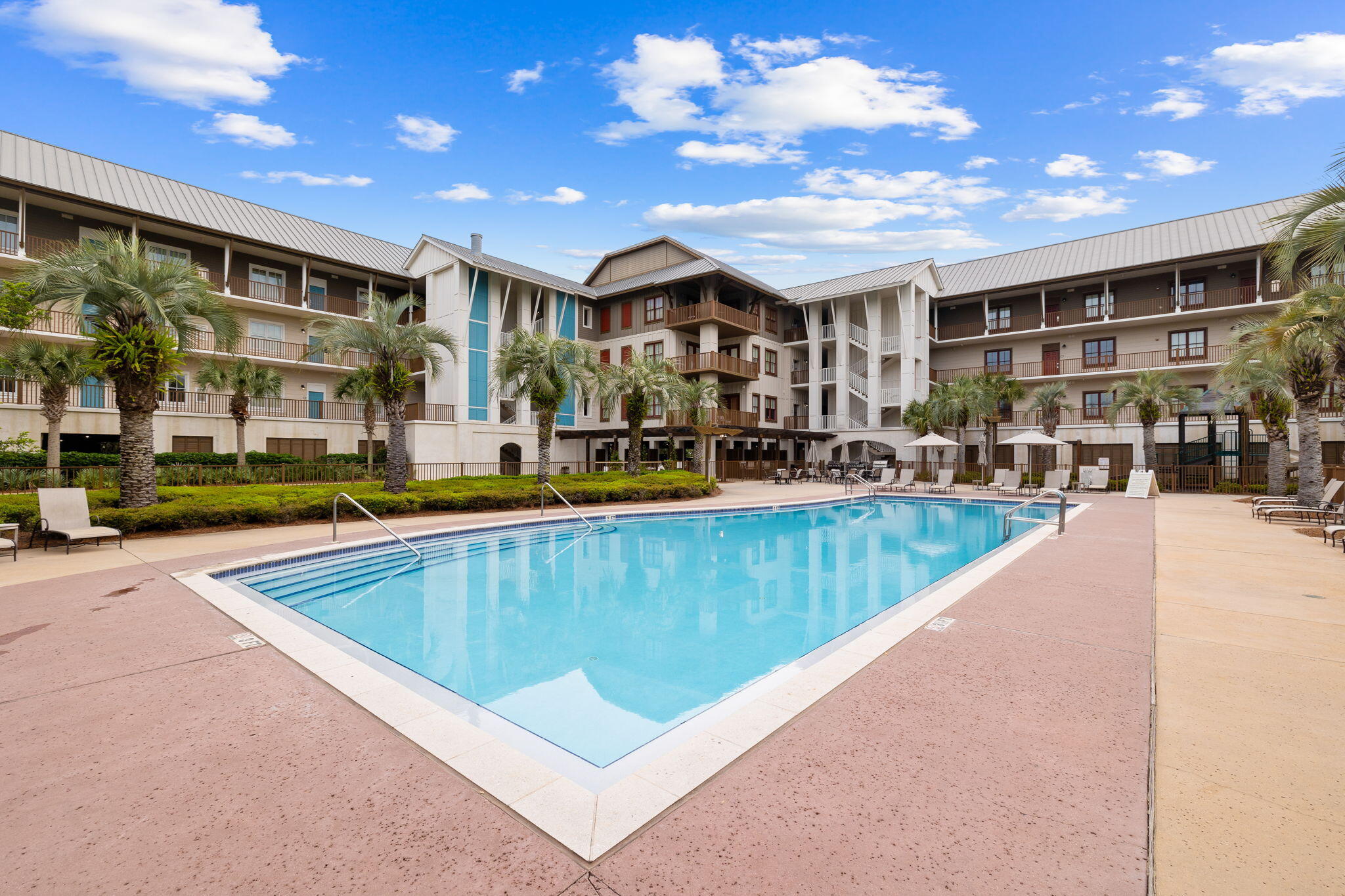 2046 West County Highway 30A, Unit M2230 Santa Rosa Beach, FL 32459 - Photo 34 of 39 a view of a swimming pool with outdoor seating