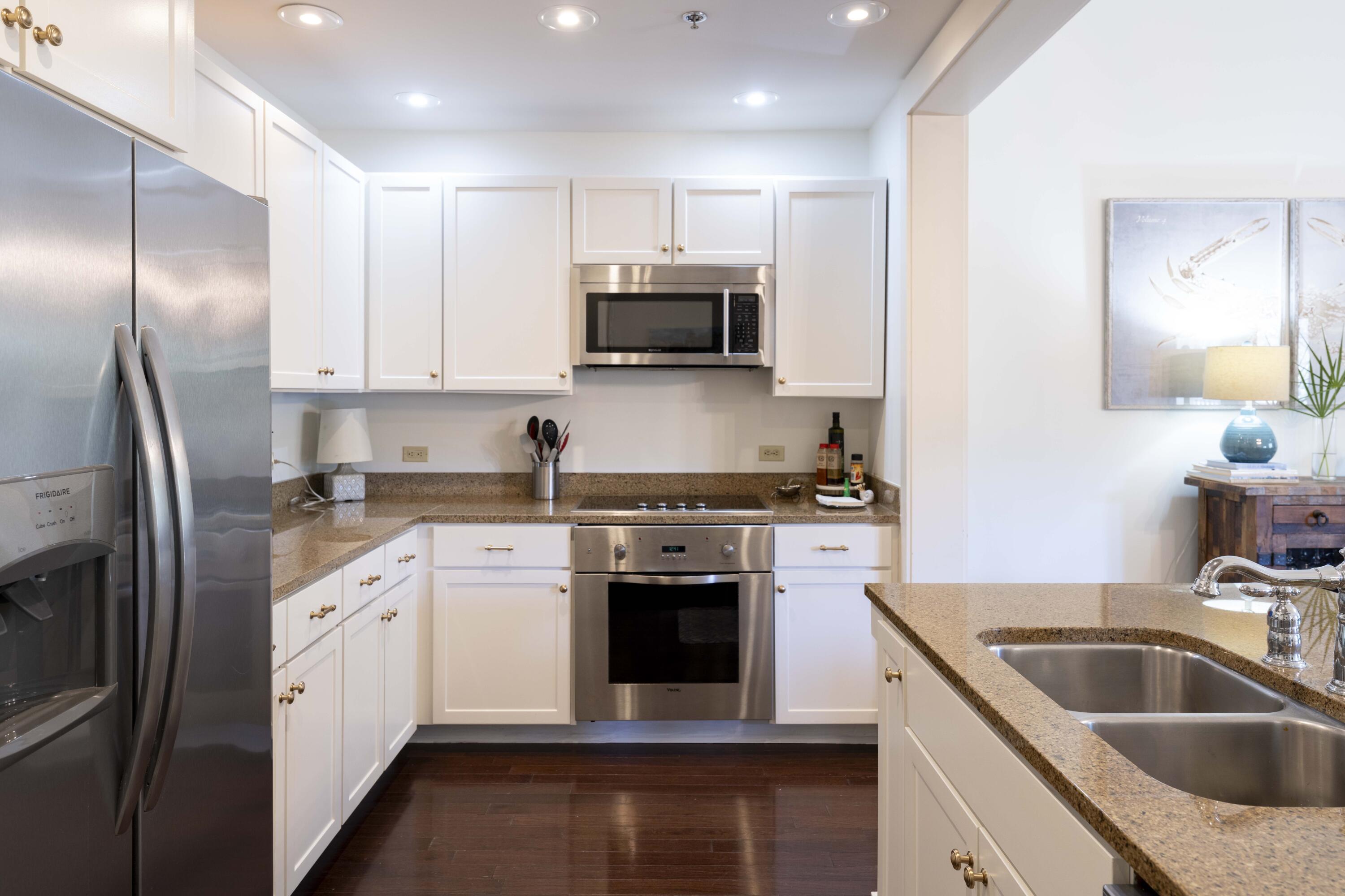 2046 West County Highway 30A, Unit M2230 Santa Rosa Beach, FL 32459 - Photo 8 of 39 a kitchen with a sink stove and refrigerator