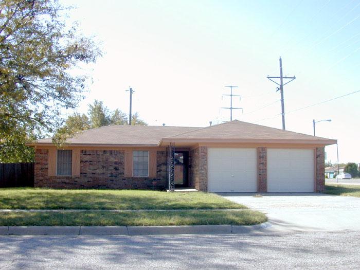 2413 Southwest 50th Avenue Amarillo, TX 79110 - Photo 1 of 1 a front view of a house with a garden