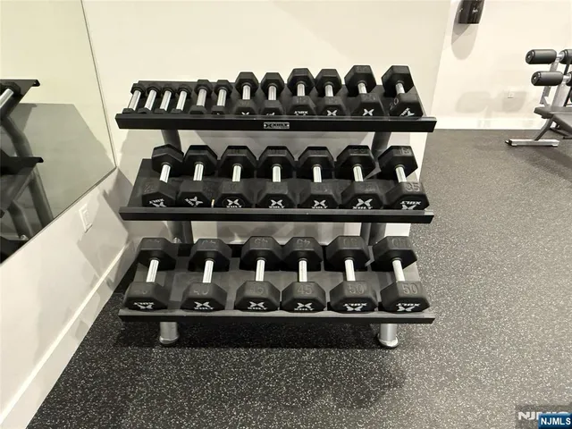 a table with wine bottles and glasses on it