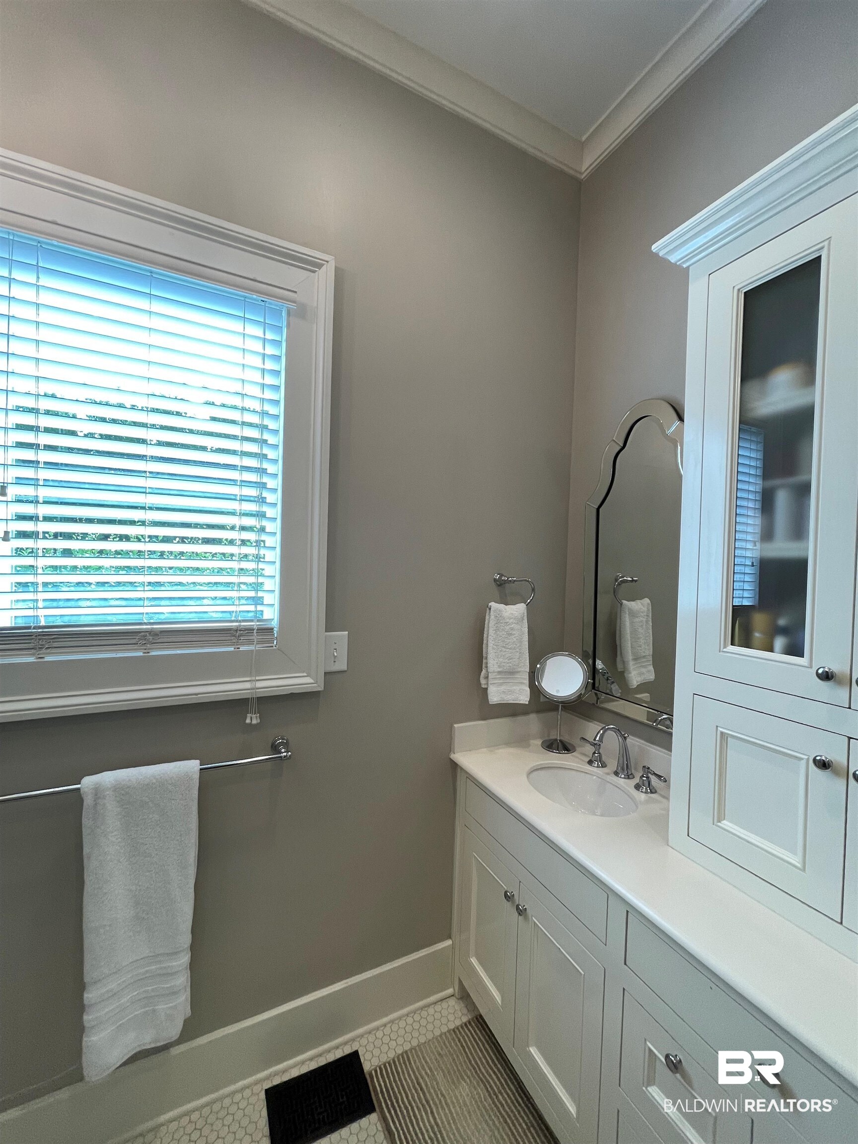 1001 Augusta Street Mobile, AL 36604 - Photo 21 of 26 Bathroom featuring vanity, crown molding, and tile patterned floors