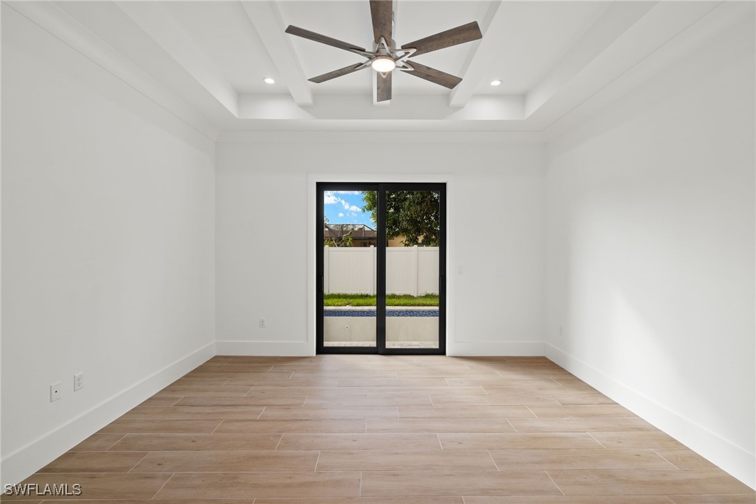 548 109th Avenue North Naples, FL 34108 - Photo 17 of 37 an empty room with windows and ceiling fan