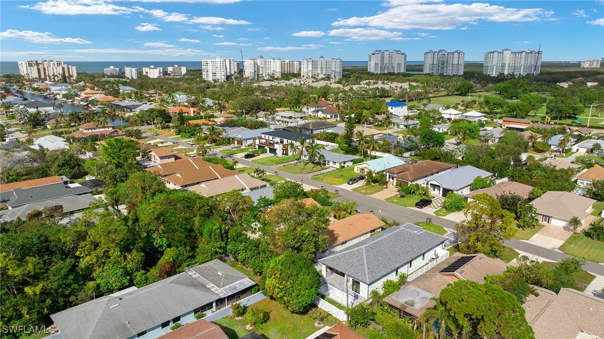 548 109th Avenue North Naples, FL 34108 - Photo 32 of 37 an aerial view of residential houses with outdoor space