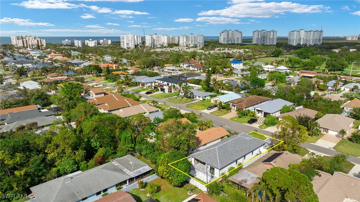 548 109th Avenue North Naples, FL 34108 - Photo 33 of 37 an aerial view of residential houses with outdoor space
