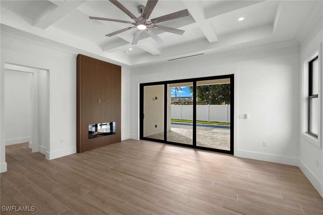 548 109th Avenue North Naples, FL 34108 - Photo 7 of 37 wooden floor in an empty room with a window