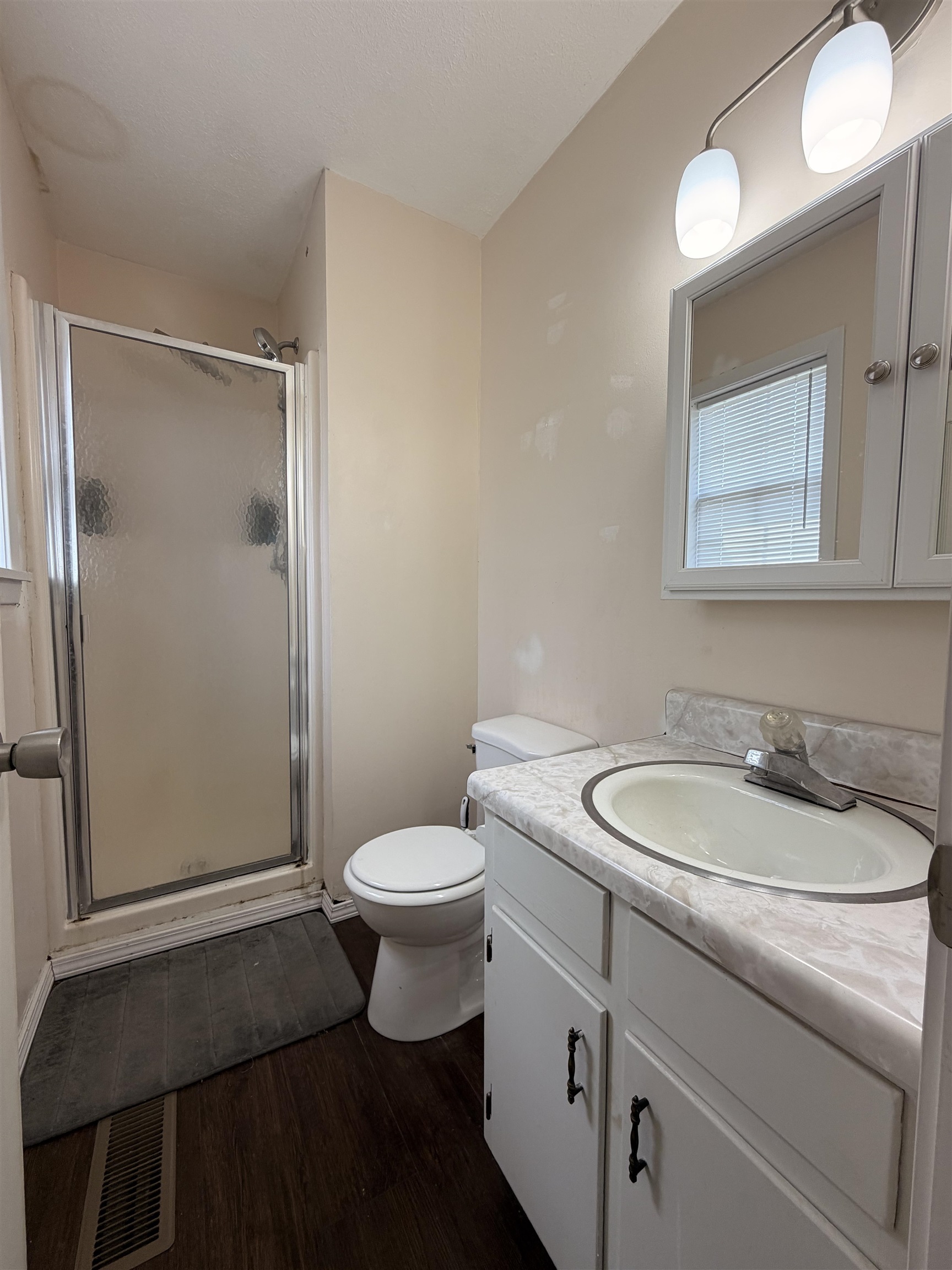 322 Robin Drive Ripley, TN 38063 - Photo 7 of 8 a bathroom with a toilet a sink and mirror
