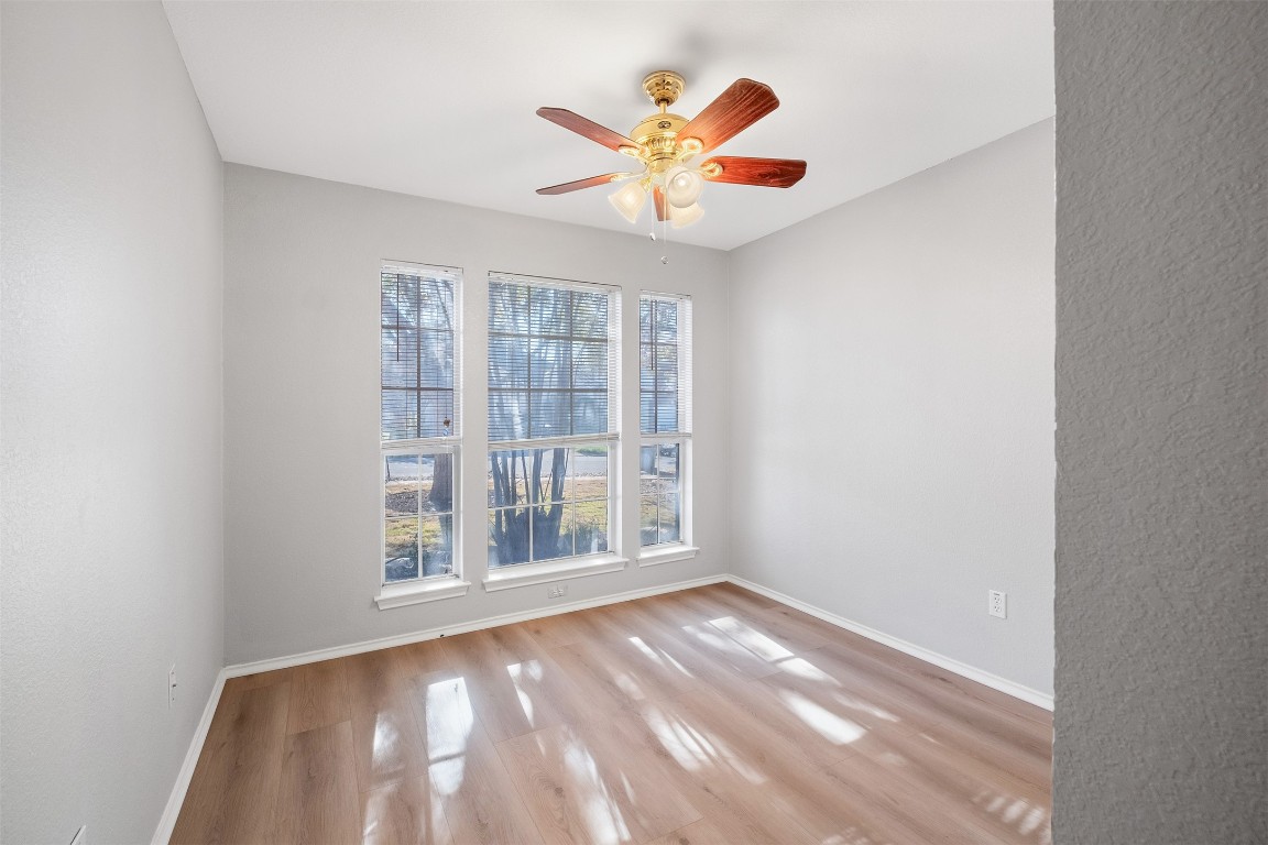 2006 Charlotte Way Round Rock, TX 78664 - Photo 14 of 24 an empty room with window and ceiling fan