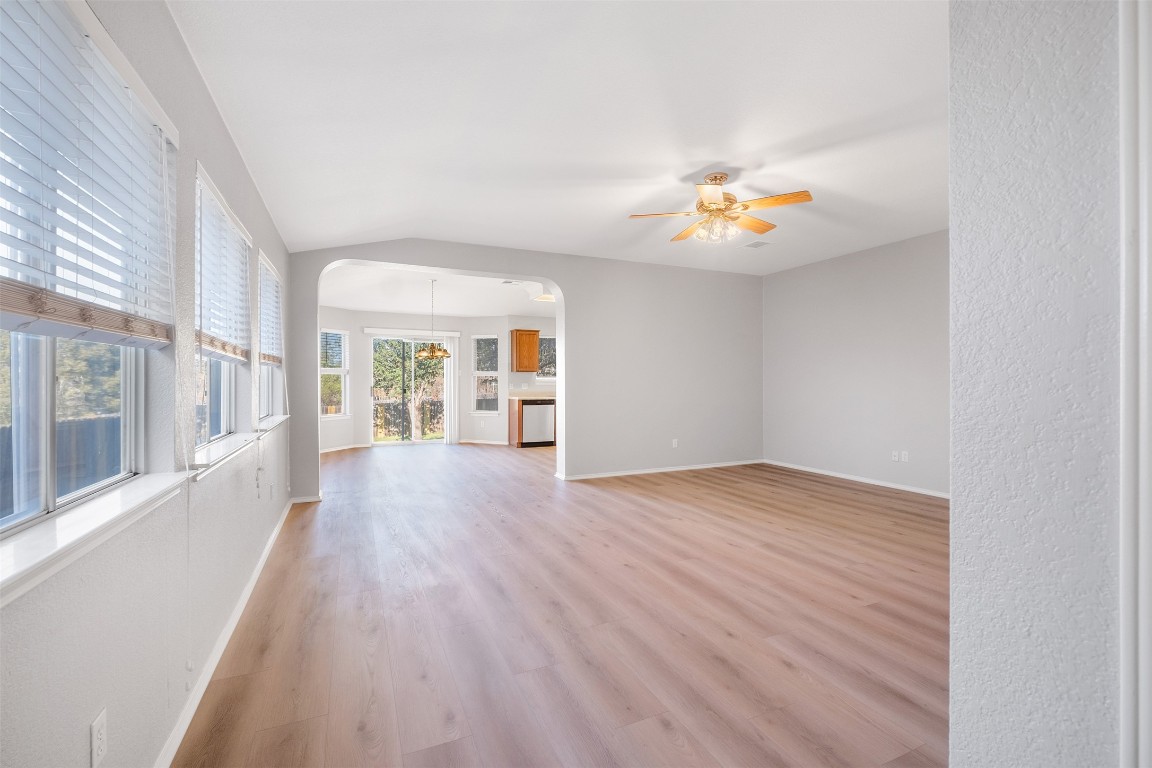 2006 Charlotte Way Round Rock, TX 78664 - Photo 2 of 24 wooden floor in an empty room with a window