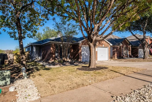 a view of a house with snow on the tree