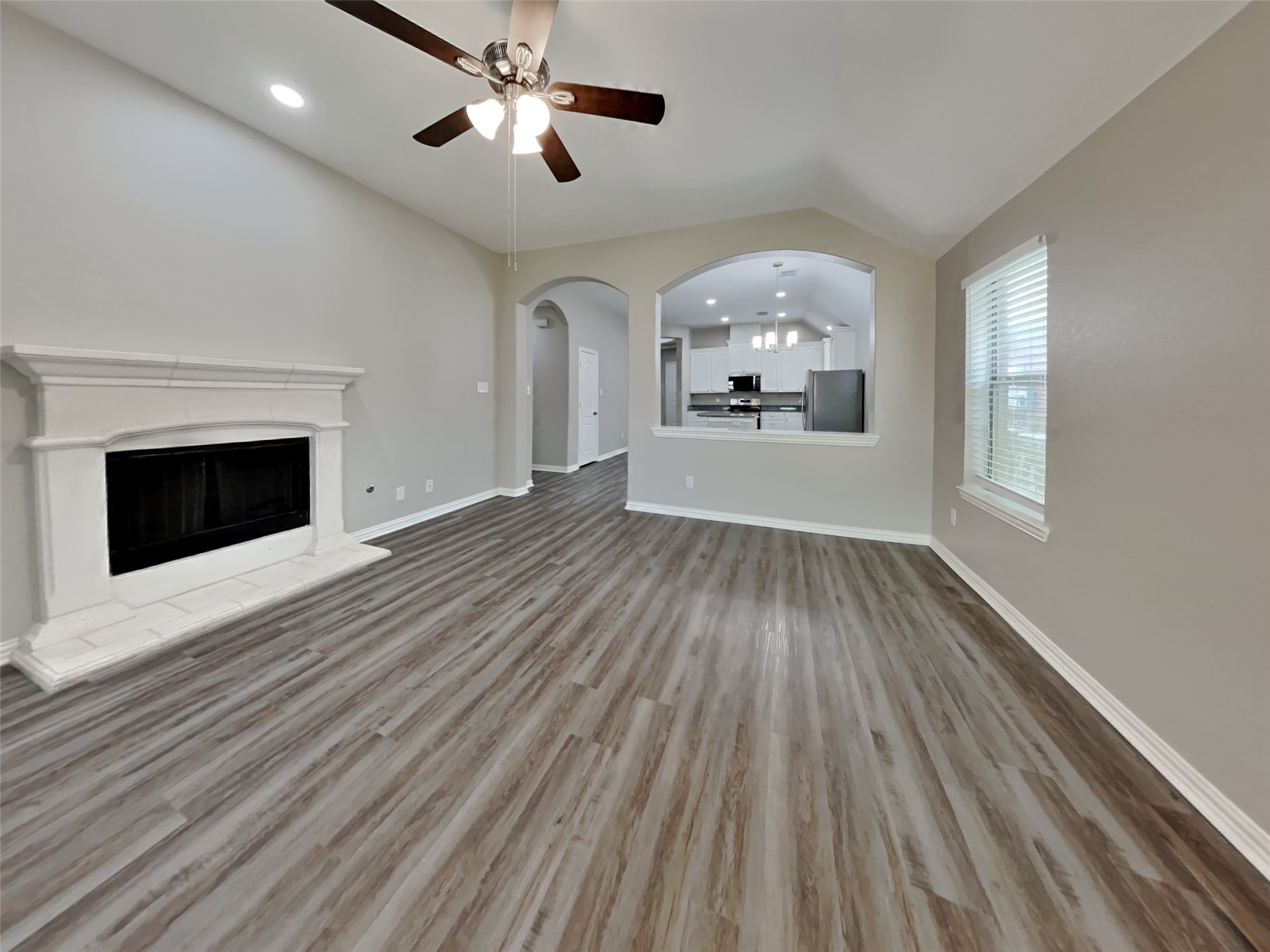 3007 Lockeridge Village Drive Spring, TX 77386 - Photo 4 of 18 wooden floor in an empty room with a window