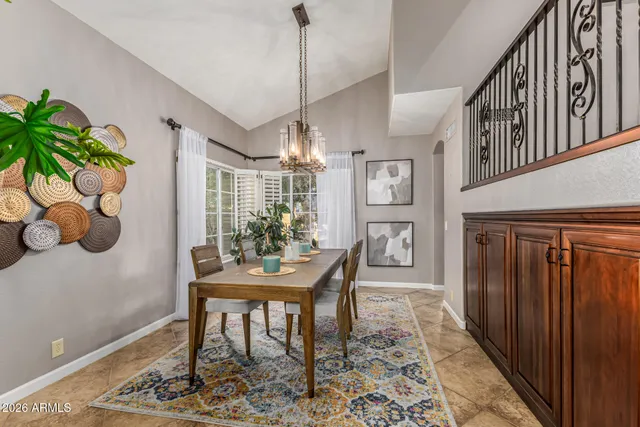 a living room with furniture a fireplace and a rug