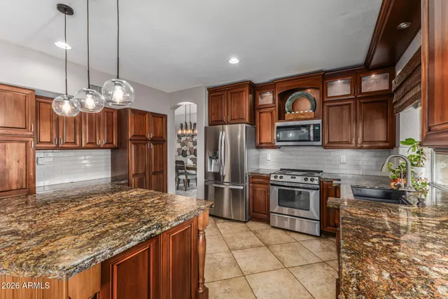 a view of a livingroom with furniture wooden floor and a floor to ceiling window