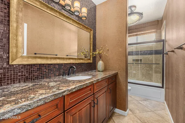 a spacious bedroom with a bed and a window