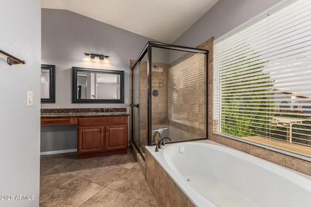 a view of a patio with table and chairs potted plants and large tree
