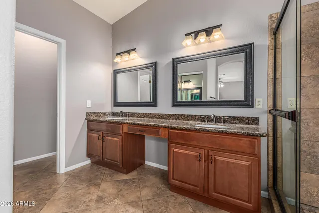 a view of a house with swimming pool and sitting area