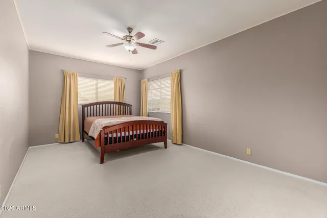 a view of a house with swimming pool and sitting area