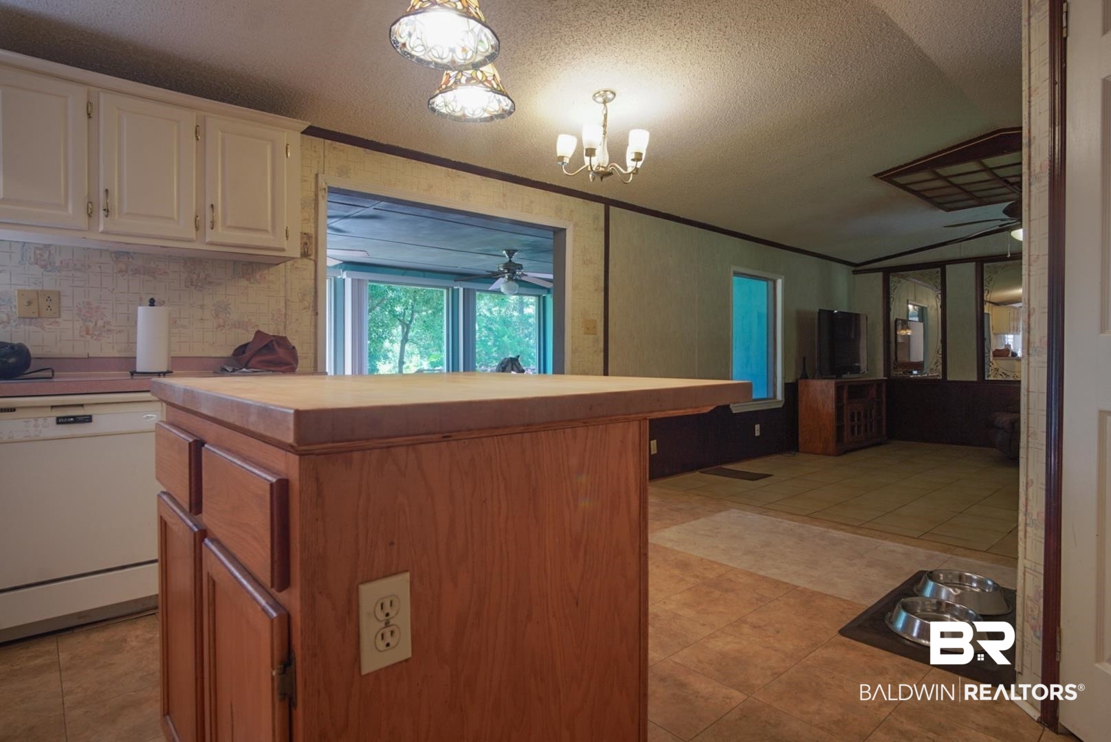 9190 County Road 97 Elberta, AL 36530 - Photo 21 of 53 Kitchen with light tile patterned flooring, ceiling fan with notable chandelier, and white dishwasher