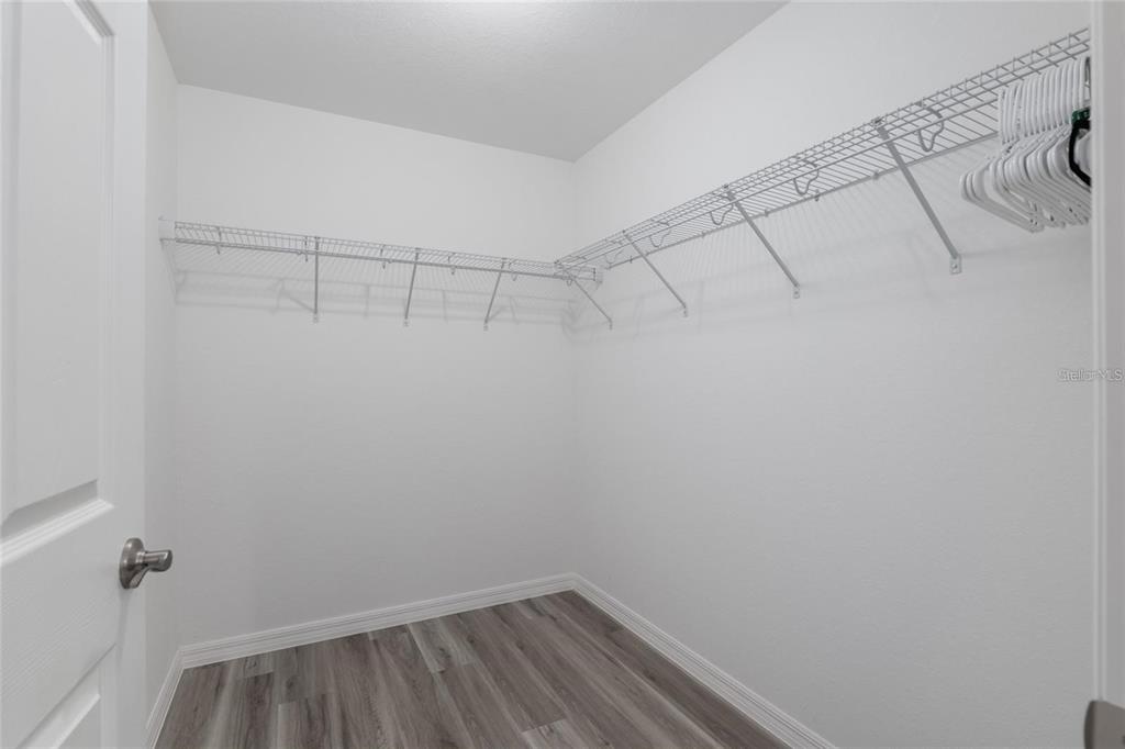 9947 Southeast 117th Street Road Belleview, FL 34420 - Photo 24 of 44 a view of a room with racks on the wall