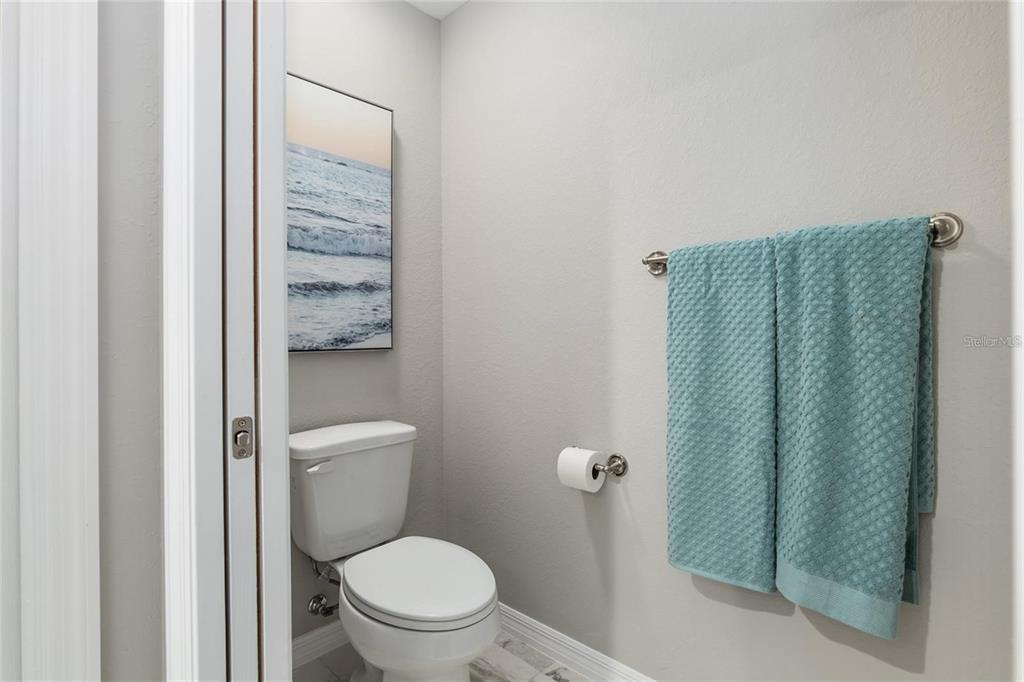 9947 Southeast 117th Street Road Belleview, FL 34420 - Photo 27 of 44 a bathroom with a toilet and a shower