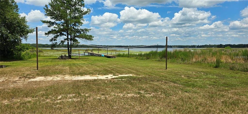 9947 Southeast 117th Street Road Belleview, FL 34420 - Photo 44 of 44 a view of a lake with a yard
