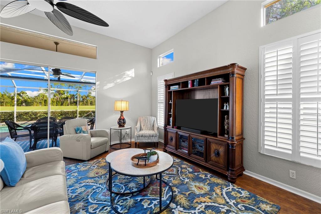1845 Pondside Lane Naples, FL 34109 - Photo 14 of 47 a living room with furniture and a flat screen tv