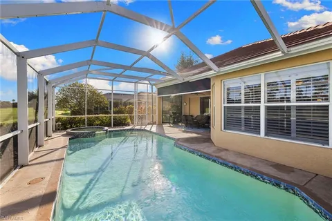 a view of a backyard with sitting area