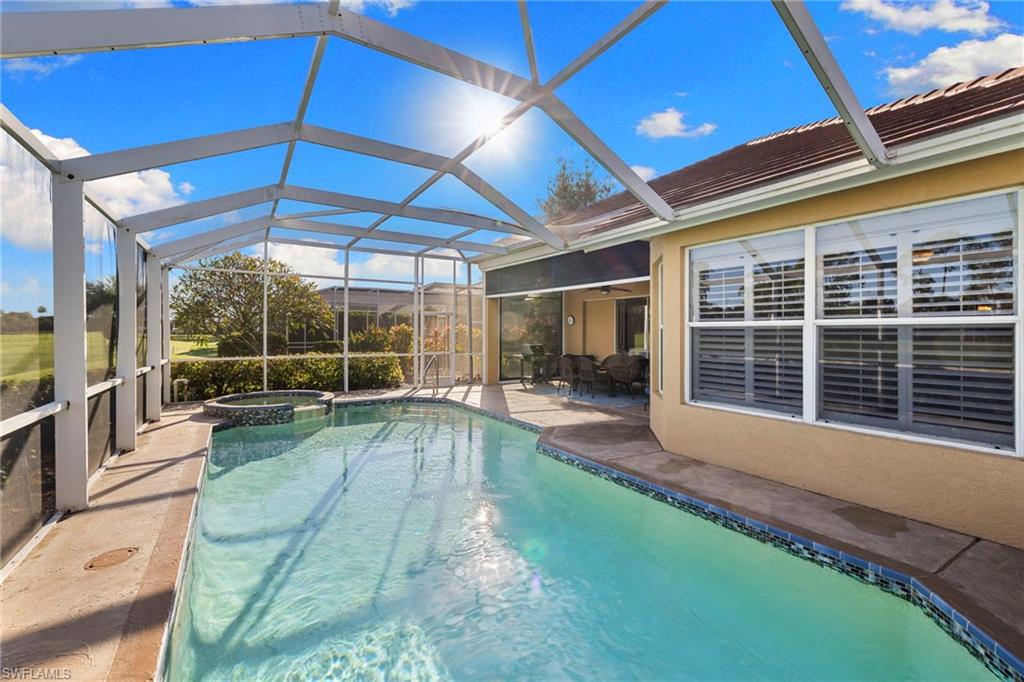 1845 Pondside Lane Naples, FL 34109 - Photo 41 of 47 a view of a backyard with sitting area