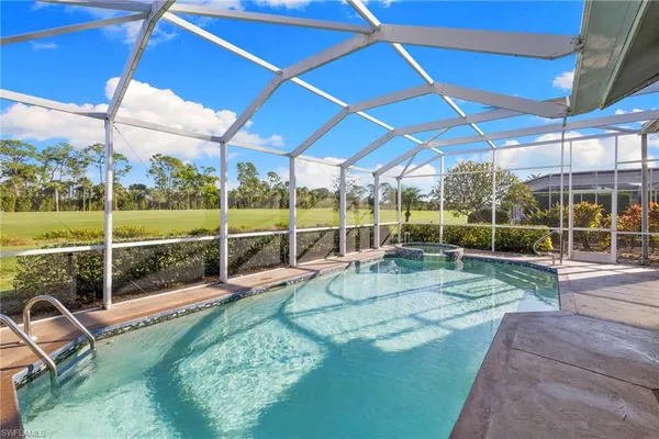 a view of a backyard with sitting area