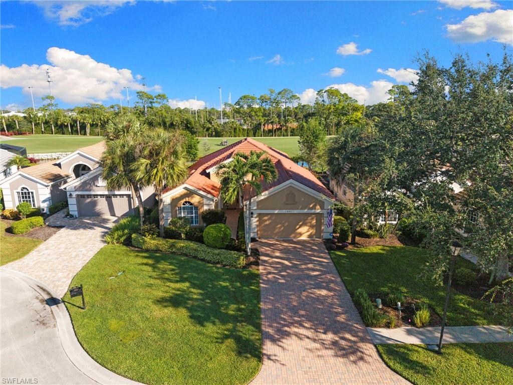 1845 Pondside Lane Naples, FL 34109 - Photo 43 of 47 a view of a house with a yard