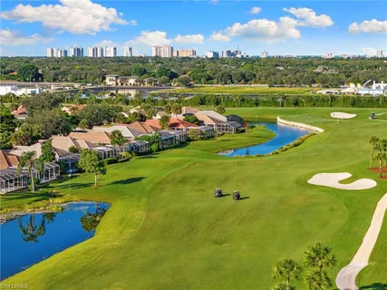 an aerial view of a house with a garden and swimming pool