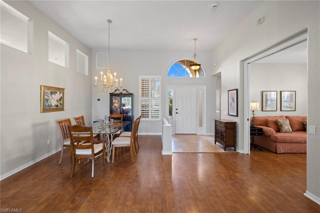 1845 Pondside Lane Naples, FL 34109 - Photo 6 of 47 a view of a livingroom with furniture and wooden floor